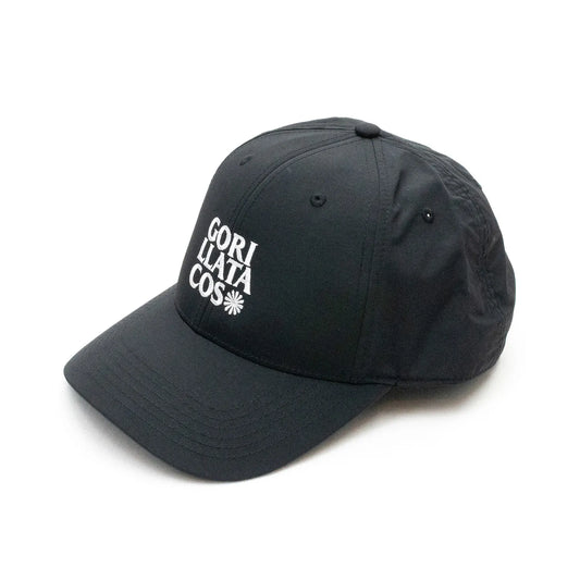 GORILLA TACOSのナイロン製のBLACKカラーのボディにフロントにWHITEカラーの刺繍でデザインされた6パネルキャップ「GT NYLON 6PALEN CAP」の斜めからの商品写真