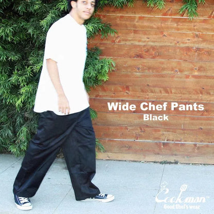 COOKMAN(クックマン)を代表するワイドパンツ「WIDE PANTS」のBLACKカラーの斜め手前からの着用写真