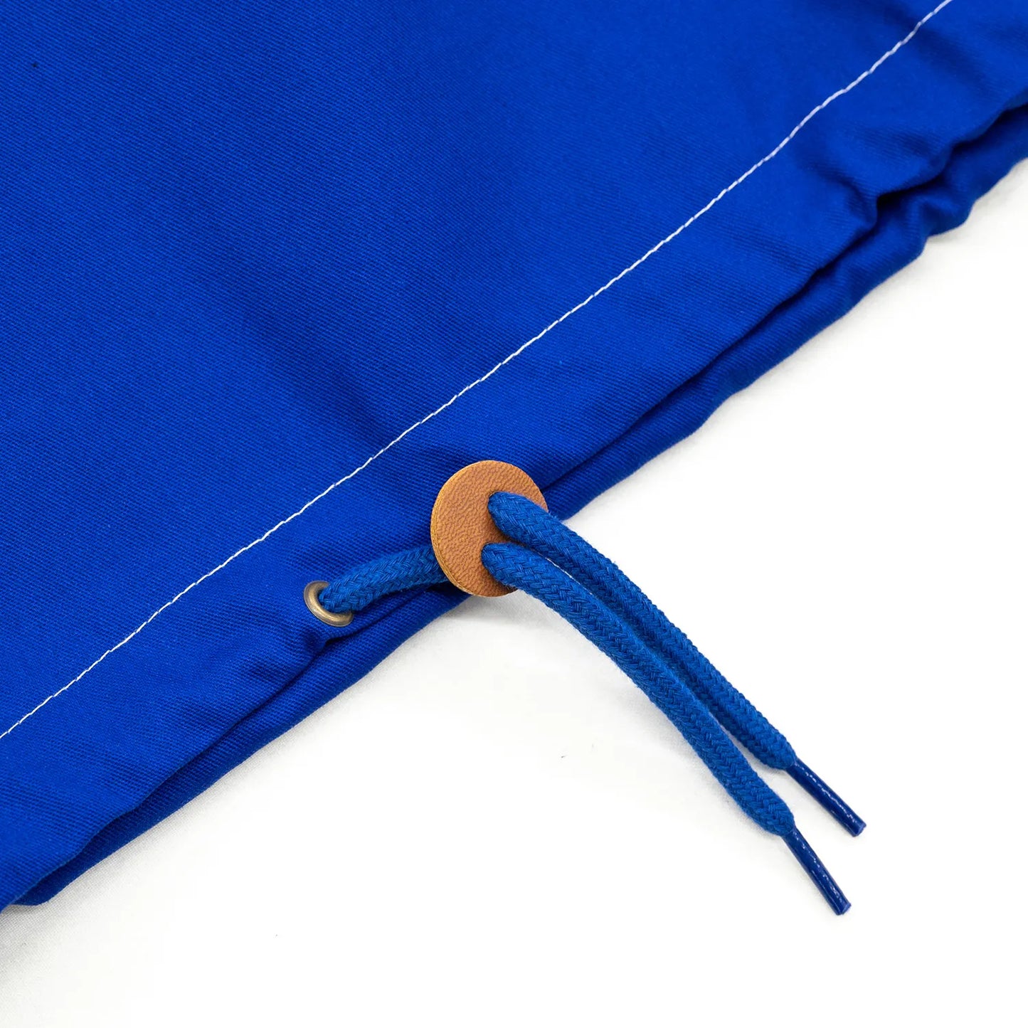 MAGENTA(マジェンタ)から待望の復刻を果たしたスケートの歴史に深く刻まれたTOM PENNYのあの伝説的アノラックジャケット「TOM 96 JACKET」のBLUEカラーのフロント裾のドローコードの写真