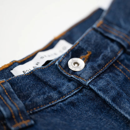 90’sストリートの空気感を色濃く残した極太シルエットが特徴のPolar Skate Co.(ポーラー)を代表する名作 「BIG BOY PANTS」のDARK BLUEカラーのフロントボタンの商品写真