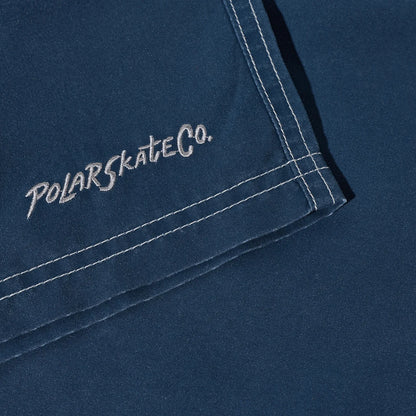 水陸両用可能なPolar Skate Co(ポーラー)のスイムショーツ「ZIGGY SWIM SHORTS」のVINTAGE INDIGOカラーの裾の刺繍デザインの写真