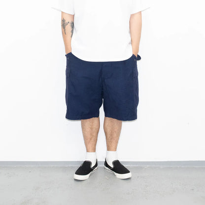 名作M-65をファットなシルエットにPrimeが理プロダクトした自信作「M-65 REMAKE CARGO SHORTS」の「NAVY」カラーの正面からの着用写真