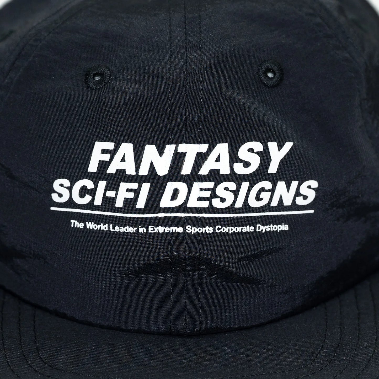 SCI-FI FANTASYのフロントにデザインがプリントされたナイロン製キャップ「EXTREME DESIGN HAT」のBLACKカラーの正面のデザイン写真