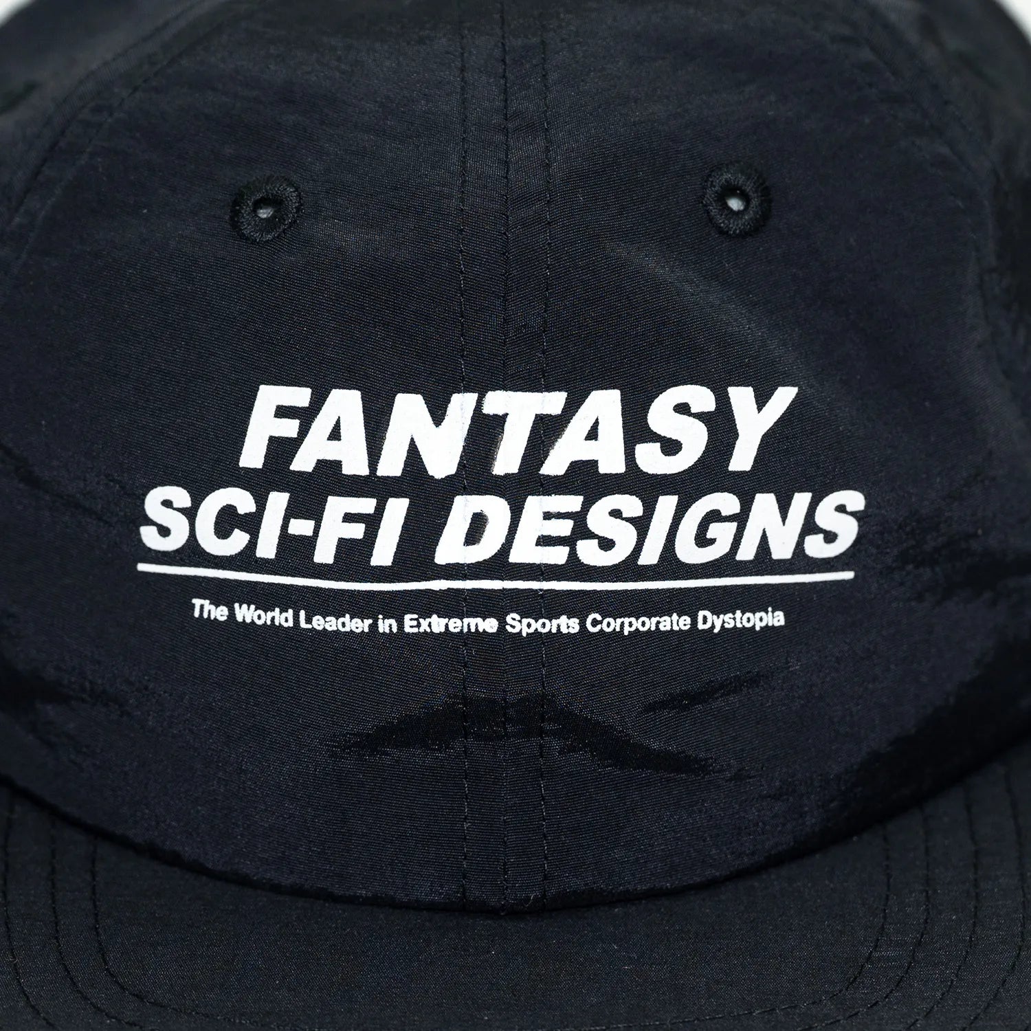 SCI-FI FANTASYのフロントにデザインがプリントされたナイロン製キャップ「EXTREME DESIGN HAT」のBLACKカラーの正面のデザイン写真