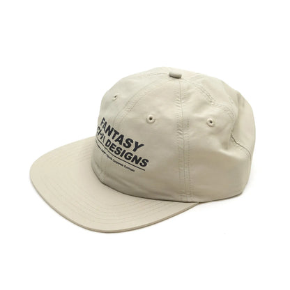 SCI-FI FANTASYのフロントにデザインがプリントされたナイロン製キャップ「EXTREME DESIGN HAT」のTANカラーの斜め左手前からの商品写真