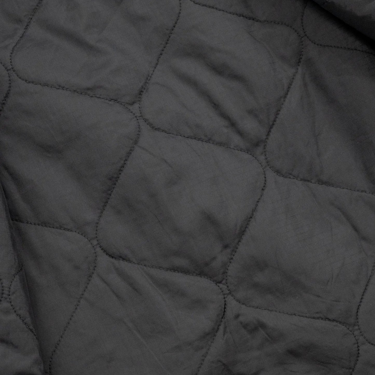 東洋エンタープライズによるTUF-NUT(タフナット)の12.5ozのコットンダック生地を使用した「COTTON DUCK WORK VEST」のBLACKカラーの裏生地の写真