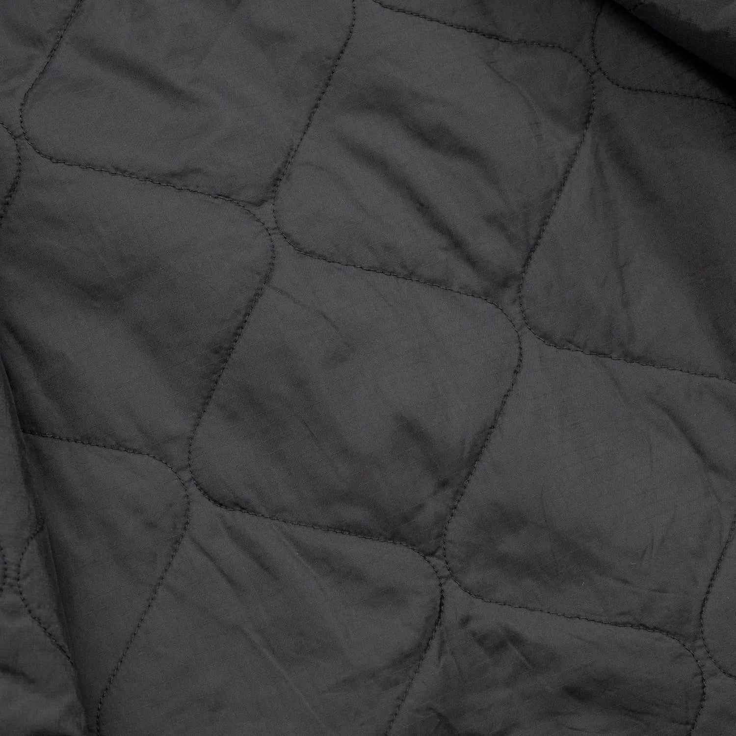 東洋エンタープライズによるTUF-NUT(タフナット)の12.5ozのコットンダック生地を使用した「COTTON DUCK WORK VEST」のBLACKカラーの裏生地の写真