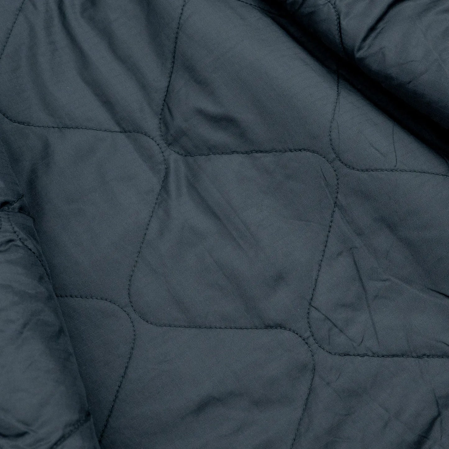 東洋エンタープライズによるTUF-NUT(タフナット)の12.5ozのコットンダック生地を使用した「COTTON DUCK WORK VEST」のCAMELカラーの裏生地の写真